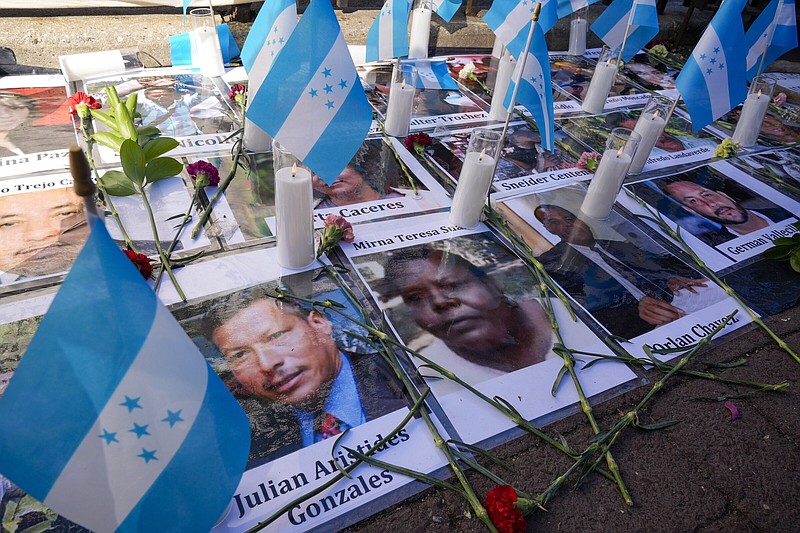A makeshift shrine with photos of a victim of Honduran drug cartels is seen outside Federal court on Friday in New York.
(AP/Mary Altaffer)