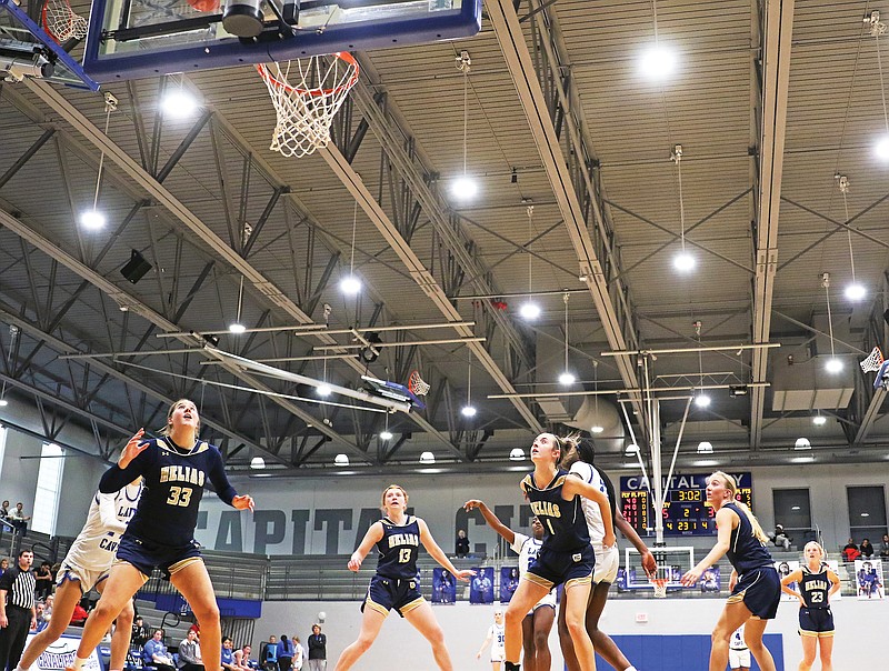 The Helias Lady Crusaders box out on a free-throw attempt by Capital City during a game in this season’s Jefferson Bank Holiday Hoops Classic at Capital City High School. (Jason Strickland/News Tribune)