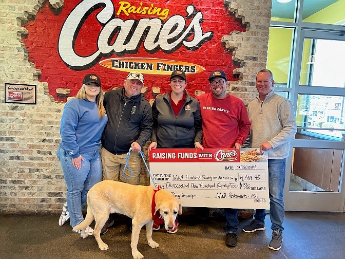 Raising Cane's in Rogers presented a check for $4,384.33 to the Northwest Arkansas Humane Society for Animals, according to an email from a restaurant representative. (courtesy photo/Raising Cane's)