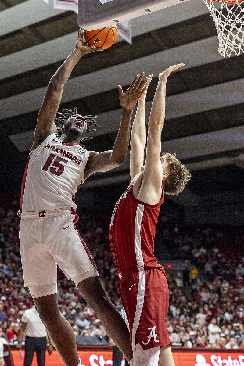 Arkansas forward Makhi Mitchell (15) shoots over Alabama forward Grant Nelson (2) during the second half of an NCAA college basketball game, Saturday, March 9, 2024, in Tuscaloosa, Ala. (AP Photo/Vasha Hunt)