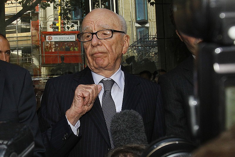 FILE - Rupert Murdoch talks with the media after he held a meeting with the parents and sister of murdered school girl Milly Dowler in London, Friday, July 15, 2011. Murdoch, whose 93rd birthday is next week, is planning to get married for the fifth time, wedding Elena Zhukova, his representative said Saturday, March 9, 2024. (AP Photo/Kirsty Wigglesworth, File)