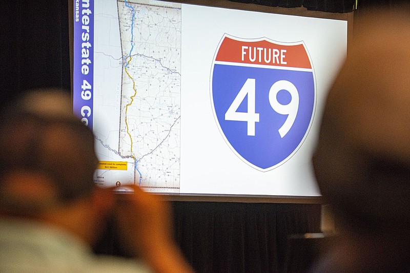 Guests view a slide at a policy discussion of the planned Interstate 49 expansion inside the Smith-Pendergraft Campus Center at the University of Arkansas-Fort Smith in this July 14, 2022 file photo. (NWA Democrat-Gazette/Hank Layton)