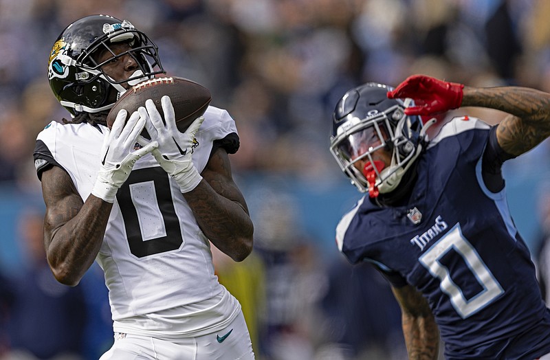AP photo by Wade Payne / Jacksonville Jaguars wide receiver Calvin Ridley catches a pass in front of Tennessee Titans cornerback Sean Murphy-Bunting during an AFC South Division matchup on Jan. 7 in Nashville. Ridley and the Titans have agreed on a four-year, $92 million contract, a person with knowledge of the terms told The Associated Press on Wednesday.