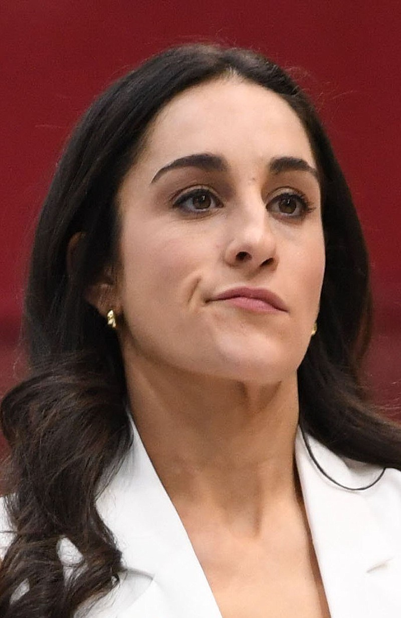 Arkansas coach Jordyn Wieber watches as her athletes compete in the vault Friday, Jan. 26, 2024, during the Razorbacks' meet with Auburn in Barnhill Arena in Fayetteville. 
(NWA Democrat-Gazette/Andy Shupe)