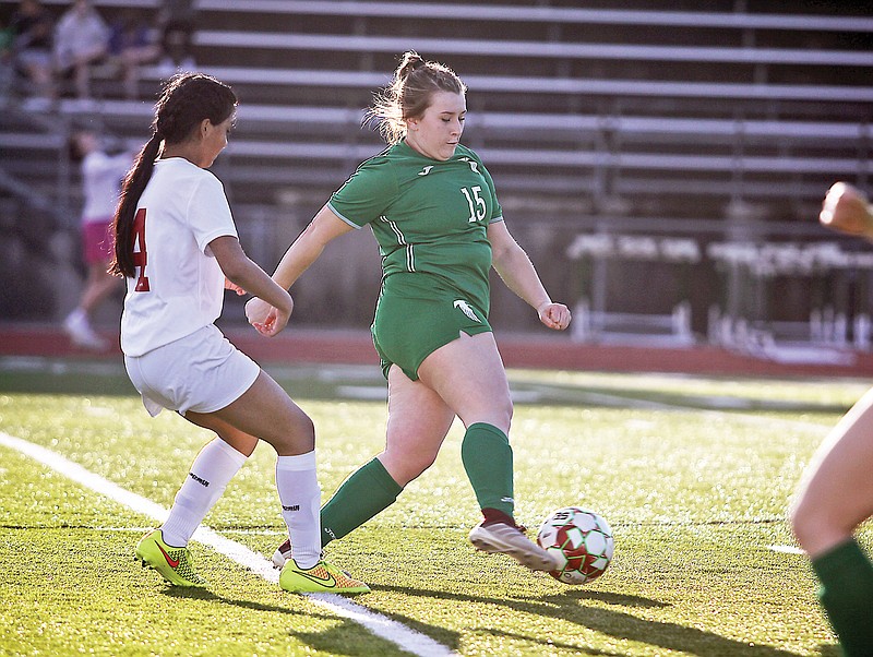 Lexi Gonzalez of Blair Oaks dribbles the ball down the field past Sedalia Sacred Heart’s Maribel Alejo during action last season at the Falcon Athletic Complex in Wardsville. (Greg Jackson/News Tribune)