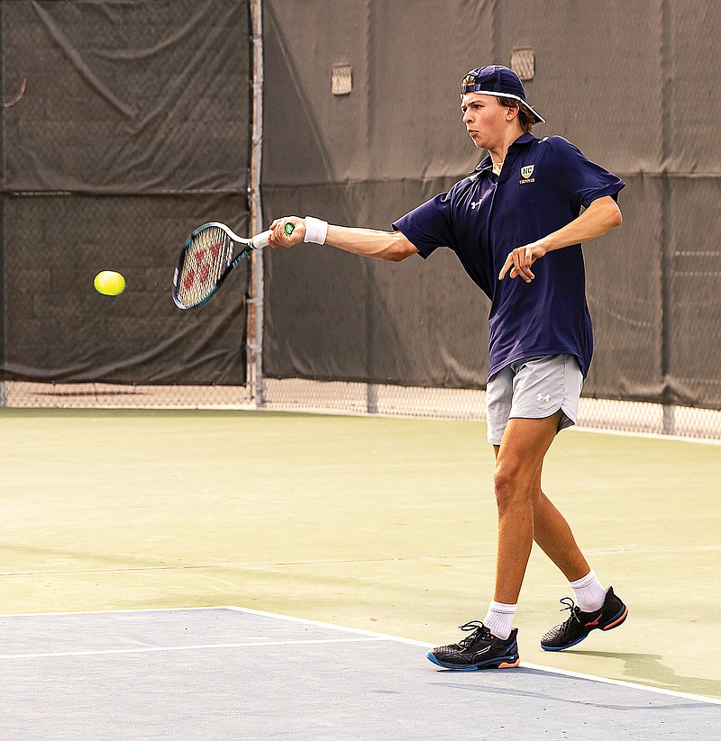 Coen Loethen of Helias hits a forehand shot during last season’s Class 2 District 5 Tournament championship dual against Jefferson City at the Crusader Athletic Complex. (News Tribune file photo)