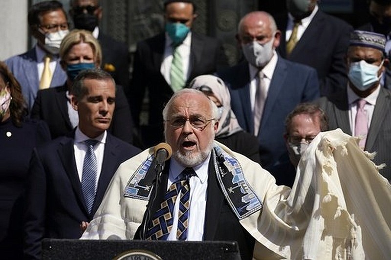 Rabbi Abraham Cooper (center) of the Simon Wiesenthal Center, speaks in front of civic and faith leaders outside City Hall in Los Angeles in May 2021. A U.S. delegation cut short a fact-finding mission to Saudi Arabia after officials in the kingdom ordered him to remove his kippah in public.
(AP/Marcio Jose Sanchez)