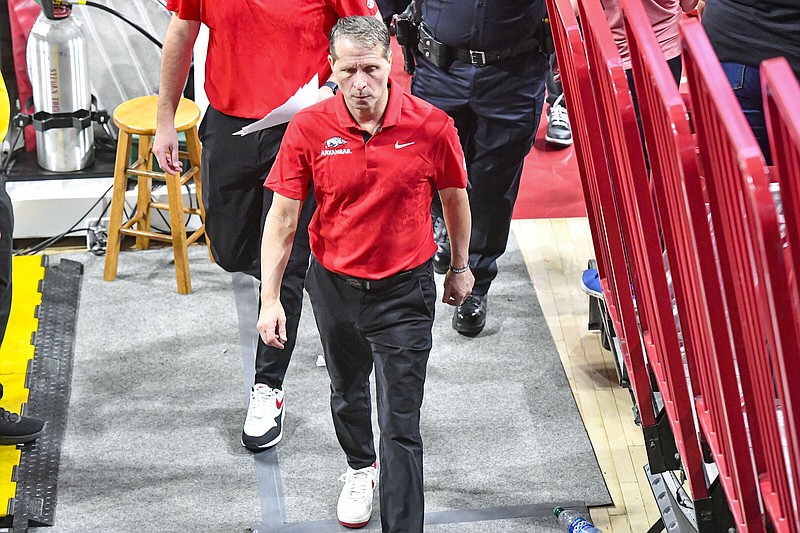 Coach Eric Musselman (above) walks off the court following Arkansas’ 92-63 loss to Tennessee on Feb. 14 at Walton Arena in Fayetteville. The Razorbacks, who were ranked No. 14 in the Associated Press and USA Today preseason coaches’ polls, finished 16-17 this season, which ended with a 80-66 loss to South Carolina on Thursday in the second round of the SEC Tournament in Nashville, Tenn.
(NWA Democrat-Gazette/Hank Layton)