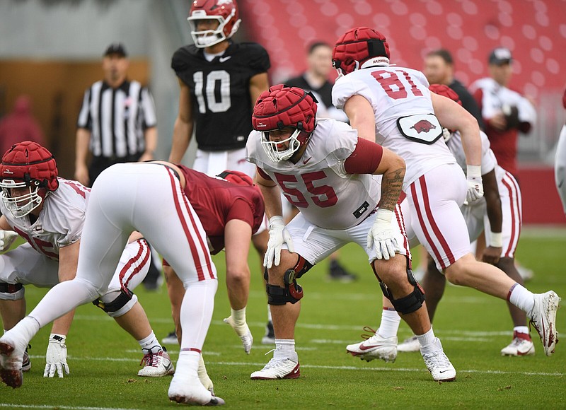 Transfer offensive tackle Fernando Carmona (55) has already made an impact as a first-teamer at left tackle and in the locker room. “That’s kind of the reason why I transferred. I want to get good reps at practice and I’m getting that right now,” Carmona said.
(NWA Democrat-Gazette/Andy Shupe)