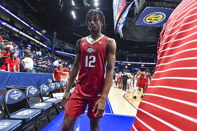 Arkansas guard Tramon Mark (12) and teammates walk off the court, Thursday, March 14, 2024, following the Razorbacks’ 80-66 loss to the South Carolina Gamecocks in the second round of the 2024 SEC Men’s Basketball Tournament at Bridgestone Arena in Nashville, Tenn. Visit nwaonline.com/photo for today's photo gallery..(NWA Democrat-Gazette/Hank Layton)
