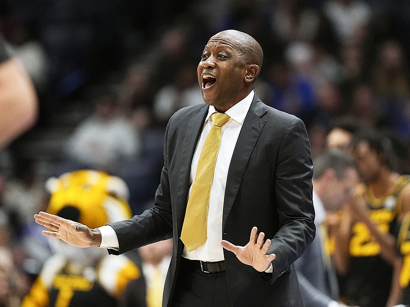 Missouri coach Dennis Gates directs his players on the floor during the first half of last Wednesday night's SEC Tournament first-round game against Georgia in Nashville, Tenn. (Associated Press)