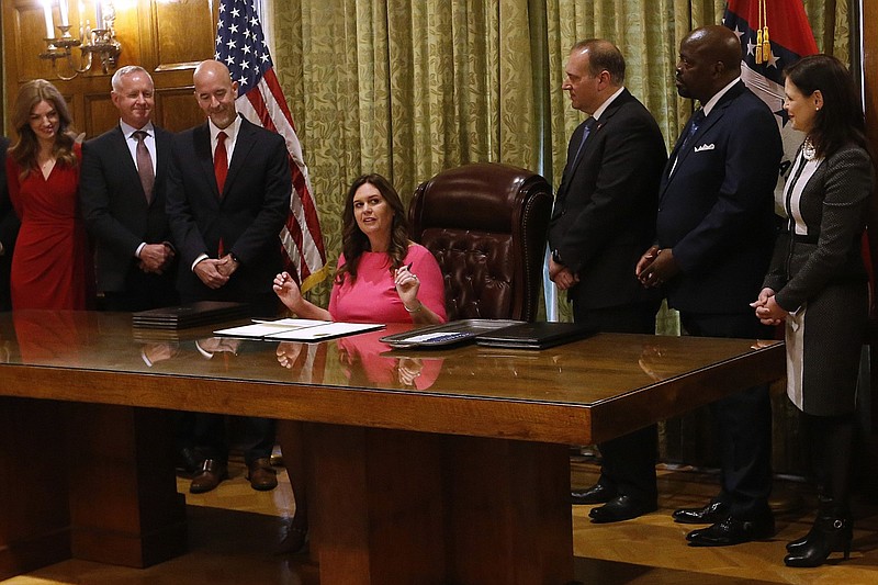 Gov. Sarah Huckabee Sanders signs her first executive orders as governor at the state Capitol in this Jan. 10, 2023 file photo. Sanders had just been inaugurated earlier that day. (Arkansas Democrat-Gazette/Thomas Metthe)