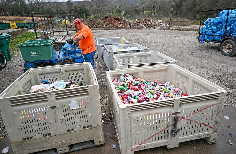 Matt Partain sorts through bags of recycling on Friday, March 15, 2024, at Boston Mountain Solid Waste District in Prairie Grove. Boston Mountain Solid Waste District is running a trail program with rural workers in an effort to increase the amount of recycling in the community. Visit nwaonline.com/photo for today's photo gallery.(NWA Democrat Gazette/Caleb Grieger)