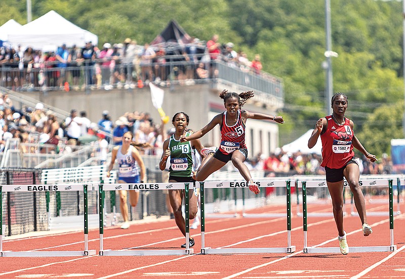 Jefferson City’s Cheria Galbreath (5) runs in the 300-meter hurdles in last year's Class 4 girls track and field state championships at Adkins Stadium. (News Tribune file photo)