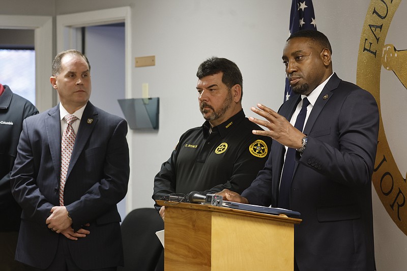 U.S. Marshal Cory Harris (right) talks about Operation Early Harvest as Faulkner County Sheriff Tim Ryals (center) and Arkansas State Police Col. Mike Hagar (left) look on Monday, March 18, 2024, at the Faulkner County Sheriff’s Criminal Investigation Division office in Conway. .(Arkansas Democrat-Gazette/Thomas Metthe)