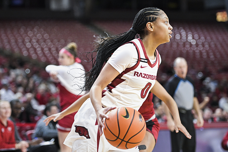Arkansas guard Taliah Scott (0) is shown, Sunday, December 31, 2023, during the first half of a basketball game at Bud Walton Arena in Fayetteville. (Charlie Kaijo/NWA Democrat-Gazette)