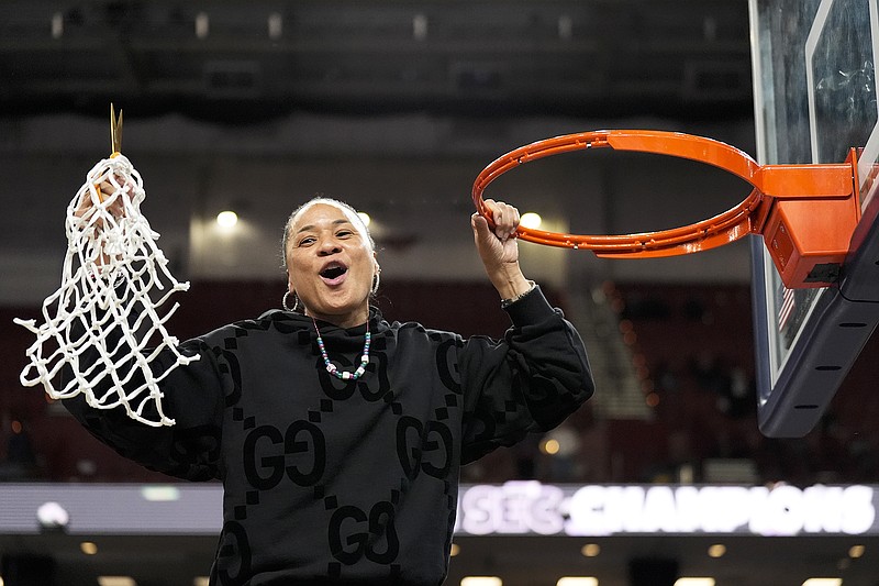 South Carolina coach Dawn Staley celebrates cutting the net after a win against LSU to win the Southeastern Conference Tournament earlier this month in Greenville, S.C. (Associated Press)