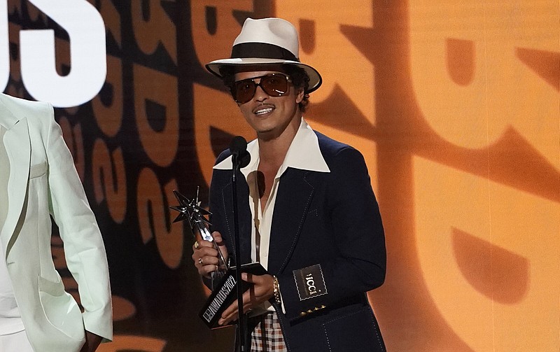 Bruno Mars accepts the award for album of the year for "An Evening with Silk Sonic" at the BET Awards on Sunday, June 26, 2022, at the Microsoft Theater in Los Angeles. (AP Photo/Chris Pizzello)