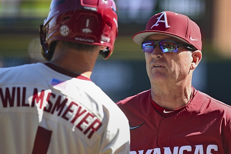Arkansas baseball Coach Dave Van Horn (right) speaks with outfielder Ty Wilmsmeyer during a March 10 game against McNeese State at Baum-Walker Stadium in Fayetteville. The top-ranked Razorbacks begin a three-game series at No. 24 Auburn today at Plainsman Park in Auburn, Ala.
(NWA Democrat-Gazette/Charlie Kaijo)
