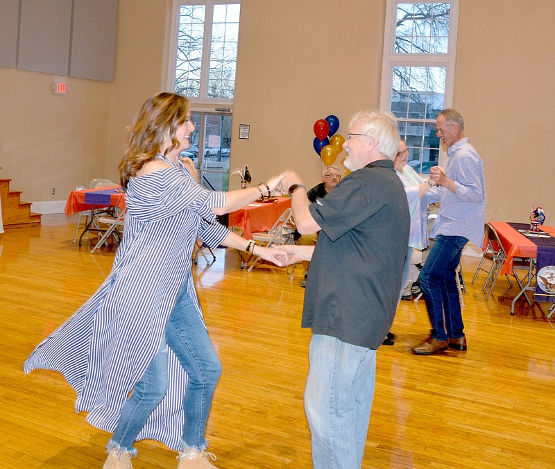Marc Hayot/Herald-Leader Cammi Hevener and Jerry Kendrick cut a rug at the Celebration of Veterans Dance on March 15, at the Siloam Springs Community Building. Hevener was one of Kendrick's students when he taught ballroom dancing at the community center from January to March.