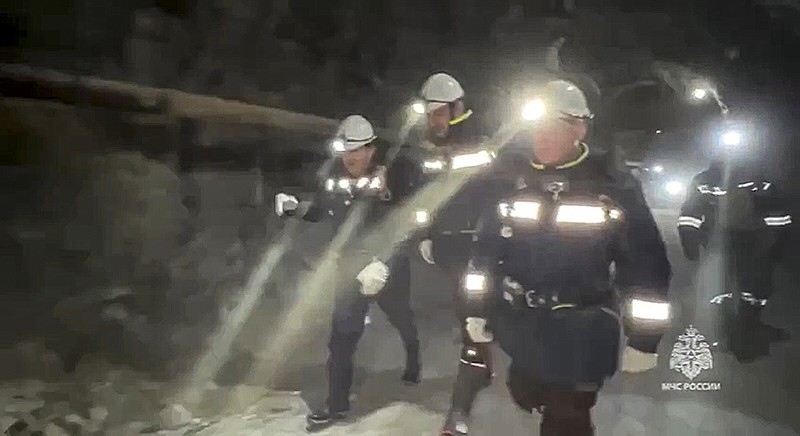 Russia Emergency Situations employees walk inside the gold mine Friday in Zeysk district, Amur region, eastern Russia.
(AP/Russia Emergency Situations Ministry)