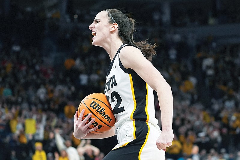 Iowa guard Caitlin Clark celebrates as time expires after an overtime win against Nebraska earlier this month to capture the Big Ten Conference Tournament title in Minneapolis. (Associated Press)