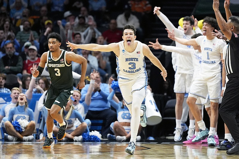 North Carolina guard Cormac Ryan celebrates after scoring against Michigan State during the second half of Saturday's second-round game in the NCAA Tournament in Charlotte, N.C. (The Associated Press)