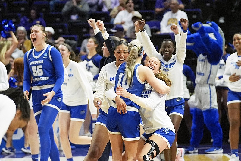 Middle Tennessee guard Jalynn Gregory celebrates with teammates after Friday's win against Louisville in a women's NCAA Tournament first-round game in Baton Rouge, La. (Associated Press)