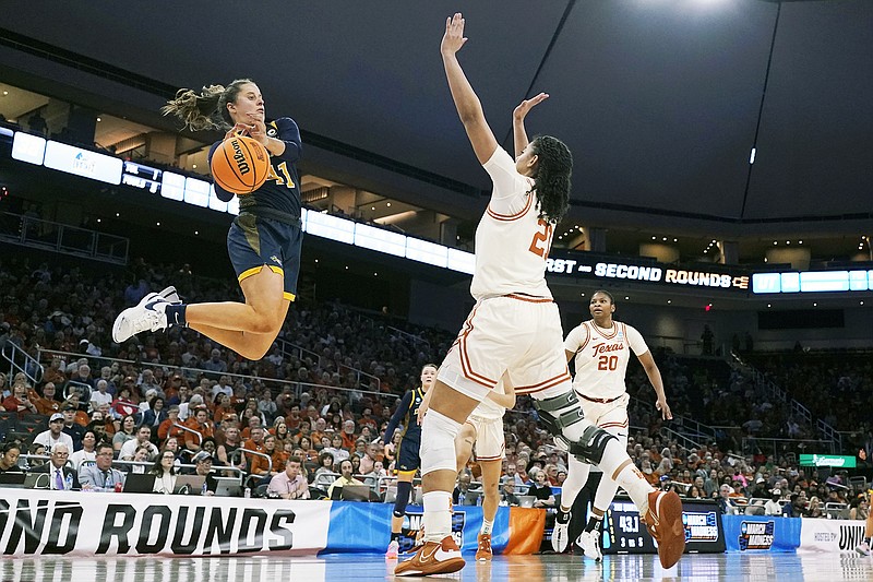 Drexel guard Laine McGurk looks to score past Texas guard Gisella Maul  during the second half of Friday's first-round game in the women's NCAA Tournament in Austin, Texas. (Associated Press)