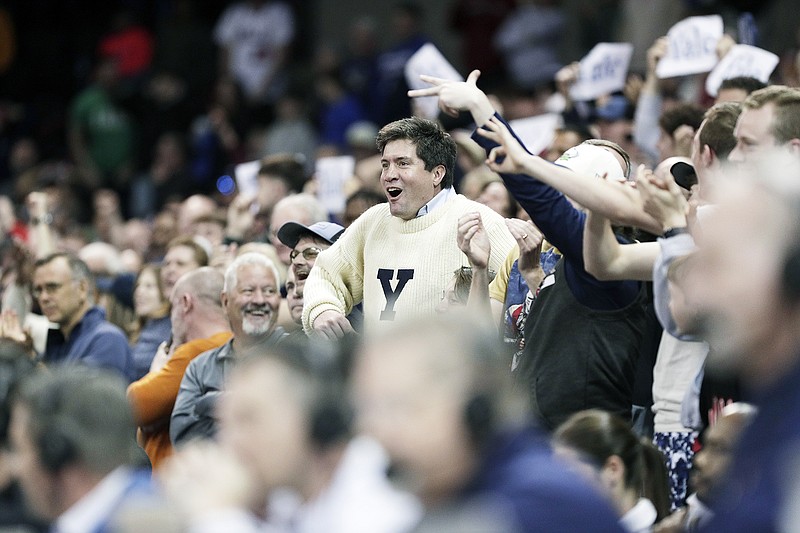 A Yale fan cheers Friday during a men's NCAA Tournament first-round game against Auburn in Spokane, Wash. (Associated Press)