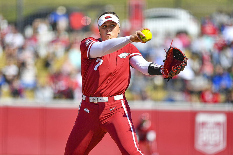 Arkansas pitcher Morgan Leinstock (7) delivers to the plate, Saturday, March 23, 2024, during the fifth inning of the Razorbacks’ 3-0 win over Mississippi State at Bogle Park in Fayetteville. (Hank Layton/NWA Democrat-Gazette)