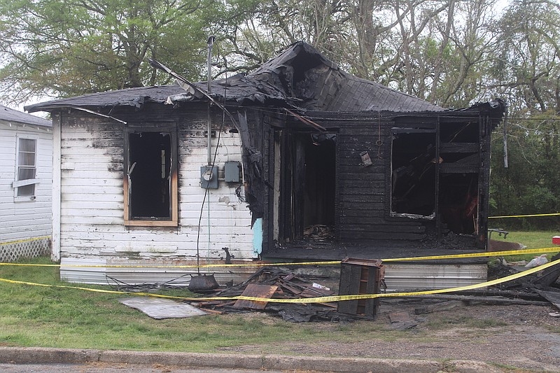 A house was badly damaged by fire early Monday morning in El Dorado, and the El Dorado Fire Department confirmed that one victim was killed during the fire. (Matt Hutcheson/News-Times)