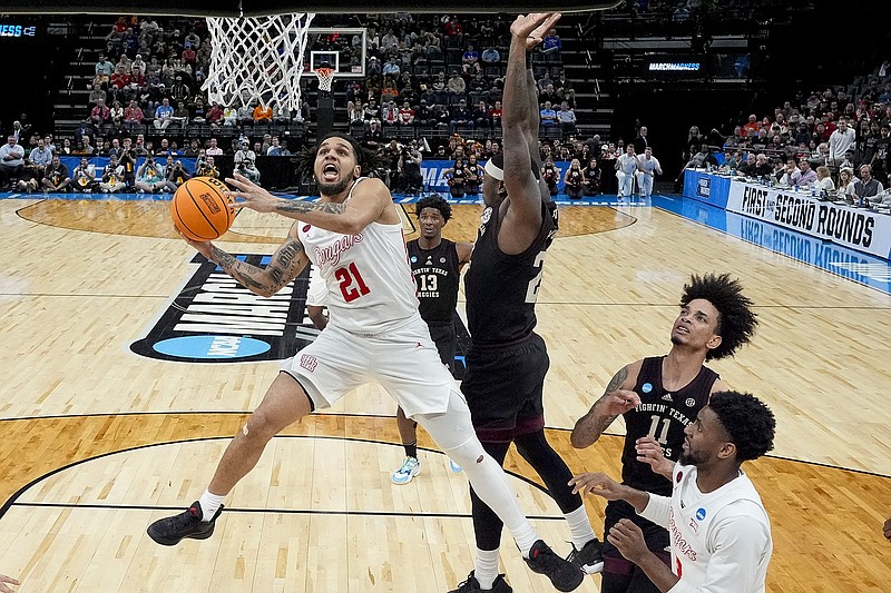 Houston guard Emanuel Sharp shoots during Sunday night's game against Texas A&M in the second round of the men's NCAA Tournament in Memphis, Tenn. (Associated Press)