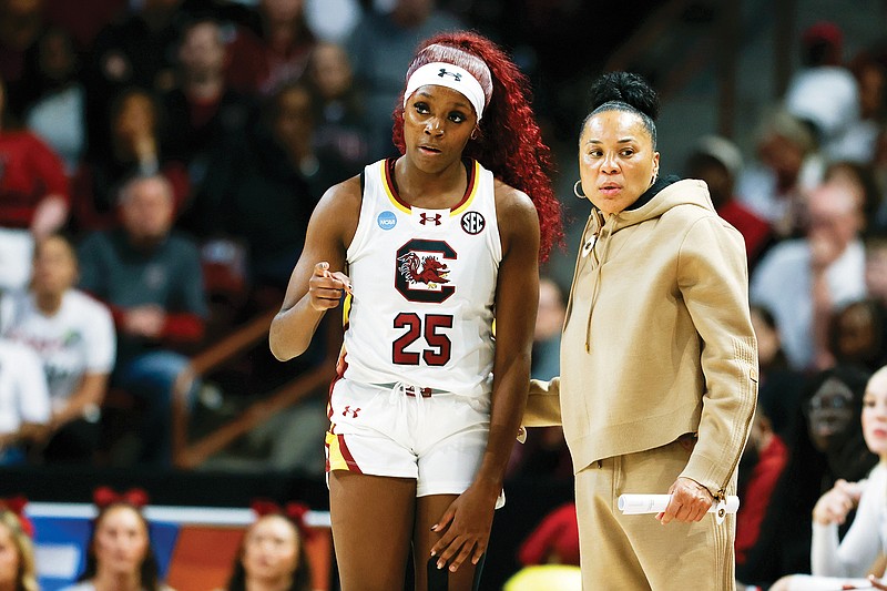 South Carolina coach Dawn Staley talks to Raven Johnson during Sunday’s second-round game against North Carolina in the women's NCAA Tournament in Columbia, S.C. (Associated Press)