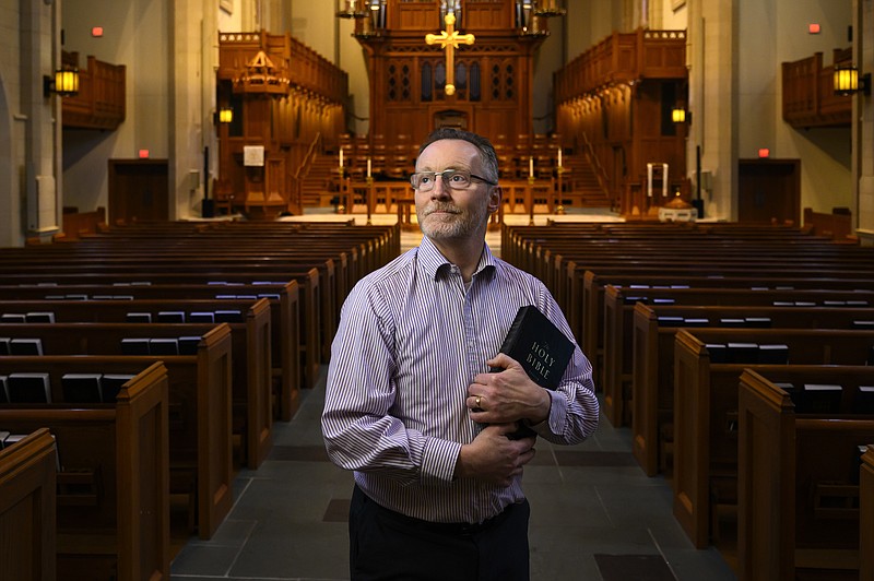  Chaplain of The Covenant School Matthew Sullivan stands in the school's church sanctuary where he lead chapel service in the past, Friday, March 22, 2024, in Nashville, Tenn. Facing the first anniversary of a tragic shooting which left six people dead, the school, which has been meeting in a temporary location, prepares to move back into the building where it happened. (AP Photo/John Amis)