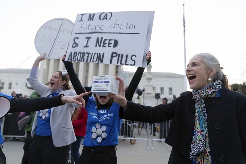 Abortion-rights activists rally outside of the Supreme Court, Tuesday, March 26, 2024, in Washington. The Supreme Court is hearing arguments in its first abortion case since conservative justices overturned the constitutional right to an abortion two years ago. At stake in Tuesday's arguments is the ease of access to a medication that was used in nearly two-thirds of all abortions in the U.S. last year.  (AP Photo/Jose Luis Magana)