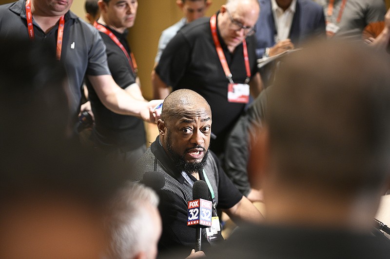 Steelers coach Mike Tomlin talks with reporters Monday during an AFC coaches availability at the NFL owners in Orlando, Fla. (Associated Press)