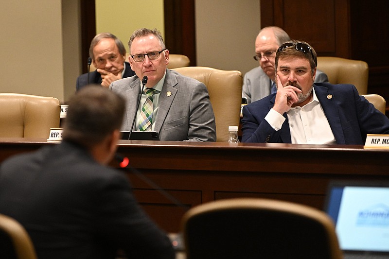 Arkansas state Reps. R. Scott Richardson (left), R-Bentonville, and Trey Steimel, R-Pocahontas, listen to state Sen. Joshua Bryant present a proposal during the House and Senate Committee on City, County, and Local Affairs joint meeting at the state Capitol on Wednesday, March 27, 2024. The proposal, which was later approved, authorizes a study on “the development of a strategy to regulate digital asset mining (also known as ‘crypto mining’) businesses within the State of Arkansas.” (Arkansas Democrat-Gazette/Staci Vandagriff)