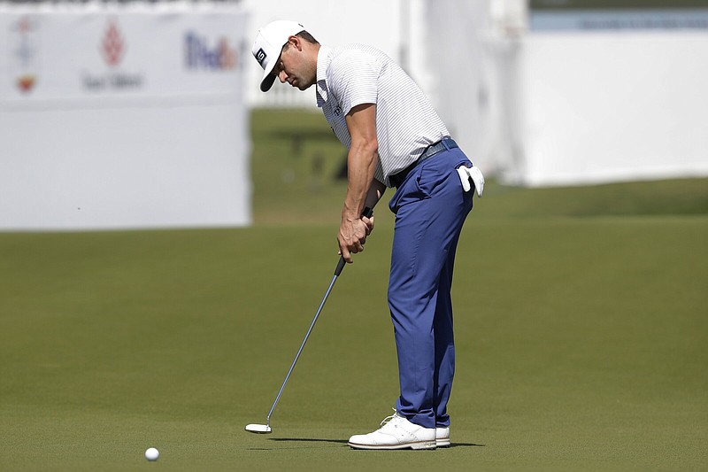 Former University of Arkansas golfer Taylor Moore putts on the 15th green during the first round of the Houston Open on Thursday in Houston.
(AP/Michael Wyke)