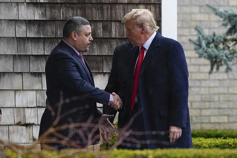 New York City Police Commissioner Edward A. Caban (left) shakes hands with former President Donald Trump on Thursday as he arrives for the wake of New York City police officer Jonathan Diller in Massapequa Park, N.Y.
(AP/Frank Franklin II)