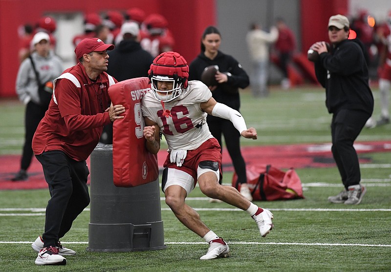Arkansas receiver Isaiah Sategna (16) was a positive on offense Thursday during the Razorbacks’ seventh practice of spring drills, including a 21-yard catch and run.
(NWA Democrat-Gazette/Andy Shupe)