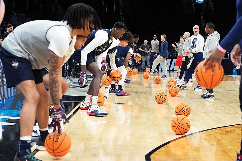 UConn players warm up before Wednesday's practice in the NCAA East Region in Boston. (Associated Press)