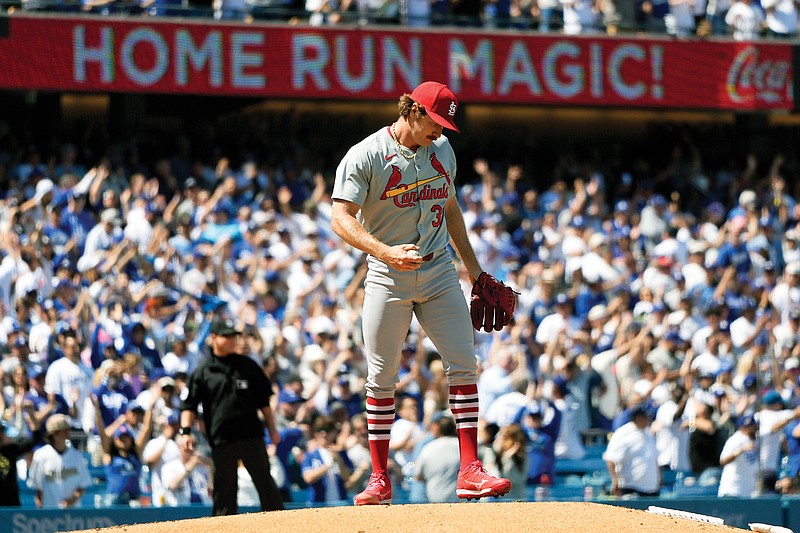 Cardinals starting pitcher Miles Mikolas stands on the mound after giving up a two-run home run to Freddie Freeman of the Dodgers in the third inning of Thursday afternoon’s game in Los Angeles. (Associated Press)