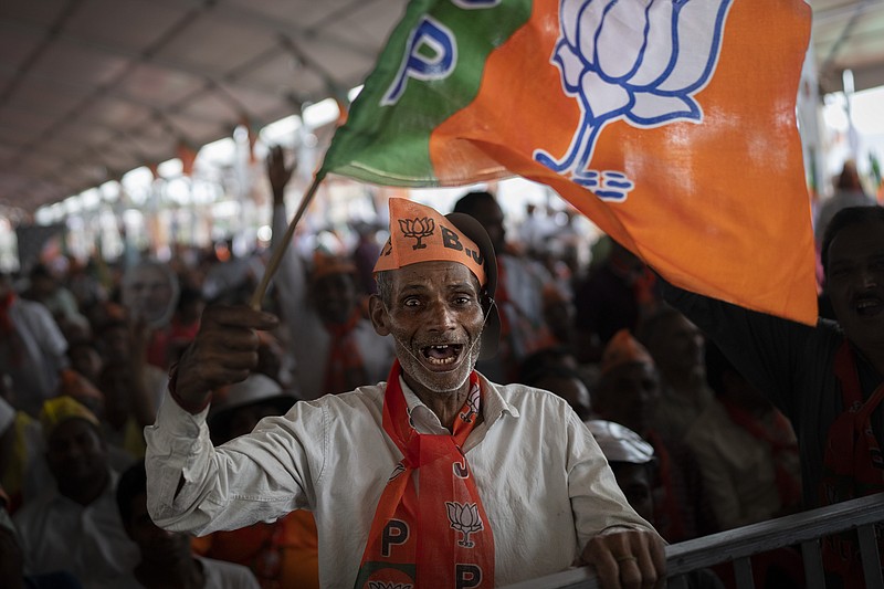 A supporter of India's ruling Bharatiya Janata Party (BJP) cheers during an election rally addressed by Indian Prime Minister Narendra Modi in Meerut, India, Sunday, March 31, 2024. (AP Photo/Altaf Qadri)
