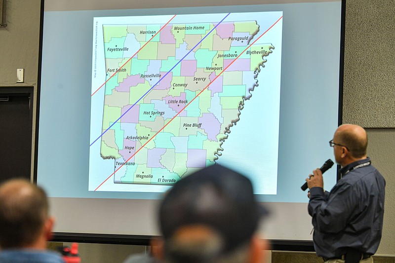 Kendall Beam, director of the Sebastian County Department of Emergency Management, leads a presentation during a multi-county solar eclipse workshop inside the Ben Geren Safe Shelter at Ben Geren Park in Fort Smith in this Oct, 5, 2023 file photo. Officials and personnel from area governments, law enforcement agencies, emergency operations centers, hospitals, schools, transportation and other entities were on hand to ask questions and provide updates on how they were preparing for the April 8, 2024 event. (River Valley Democrat-Gazette/Hank Layton)