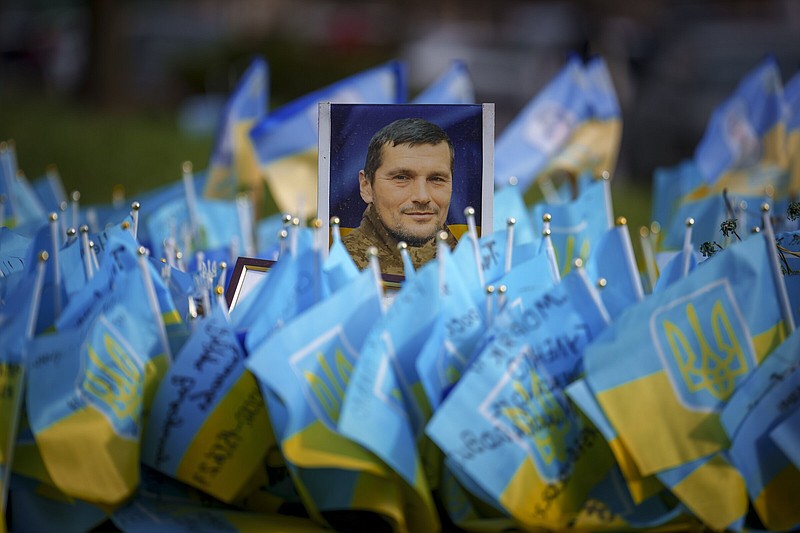 A photograph of a fallen Ukrainian serviceman is placed at a memorial in Independence Square, in Kyiv, Ukraine, on Wednesday.
(AP/Vadim Ghirda)