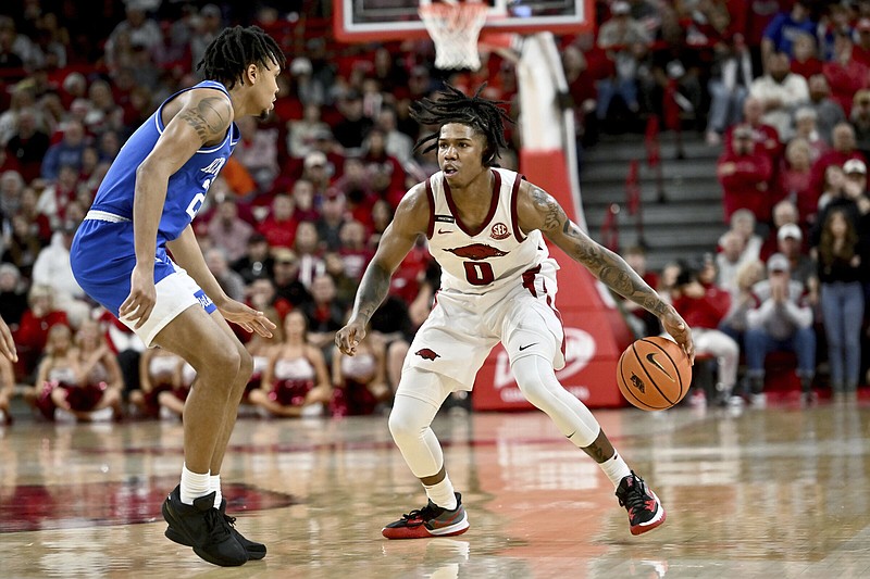 Arkansas guard Khalif Battle (0) became the latest University of Arkansas men’s basketball player to enter the transfer portal Thursday. For the season, Battle averaged 14.8 points, 3.3 rebounds and 24.8 minutes in 32 games with 13 starts this season.
(AP/Michael Woods)