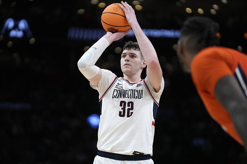 UConn center Donovan Clingan (32) takes a foul shot during the first half of the Elite 8 college basketball game against the Illinois in the men's NCAA Tournament, Saturday, March 30, 2024, in Boston. (AP Photo/Steven Senne)