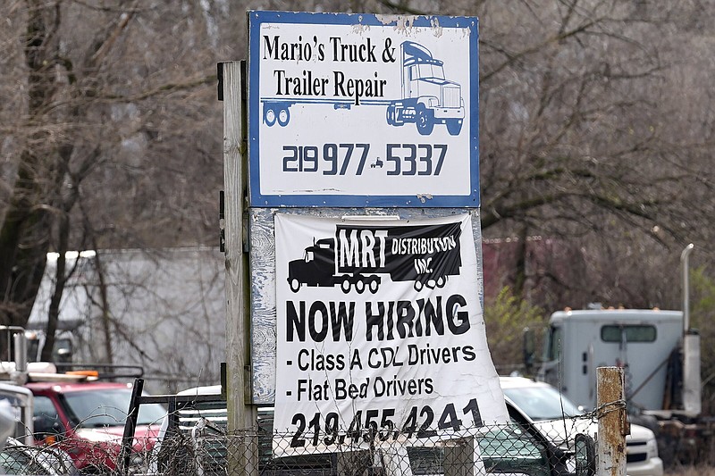 A sign seeking truck drivers is displayed at a business in Gary, Ind., in March.
(AP/Nam Y. Huh)