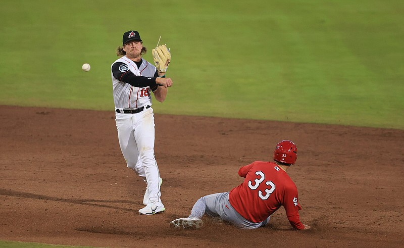 Arkansas second baseman Hogan Windish throws to first base after forcing out Springfield’s Jimmy Crooks in the Travelers’ 6-1 loss Friday night at Dickey-Stephens Park in North Little Rock.
(Arkansas Democrat-Gazette/Colin Murphey)